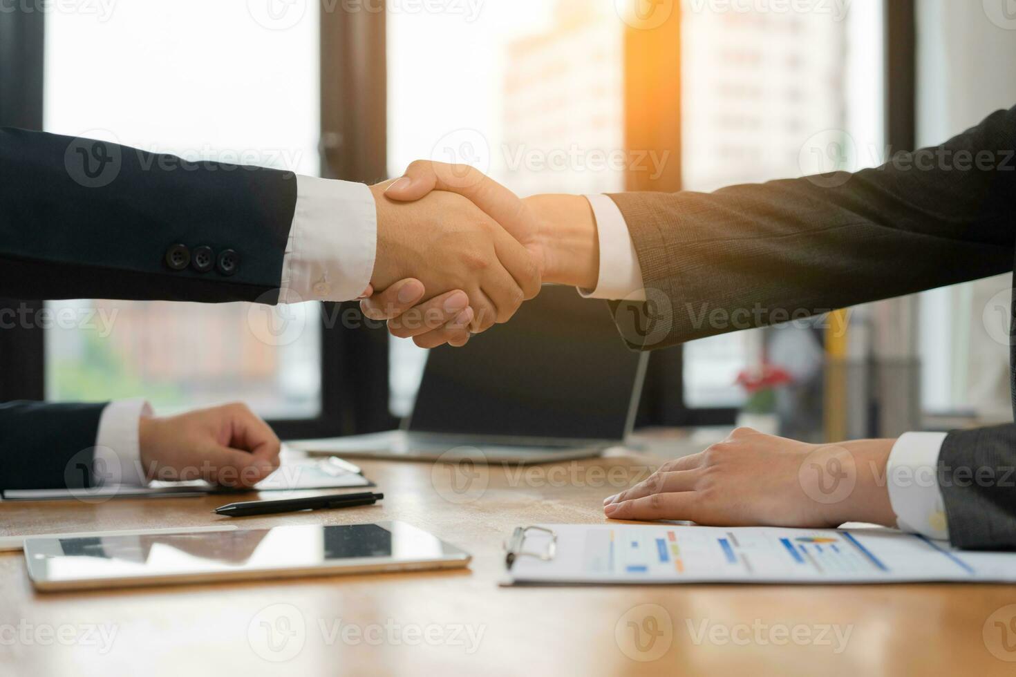 Executives are shaking hand after results success to target. financial data analysis and market growth report chart. Planning Strategies, startup project, profitable strategy, Business meeting time photo