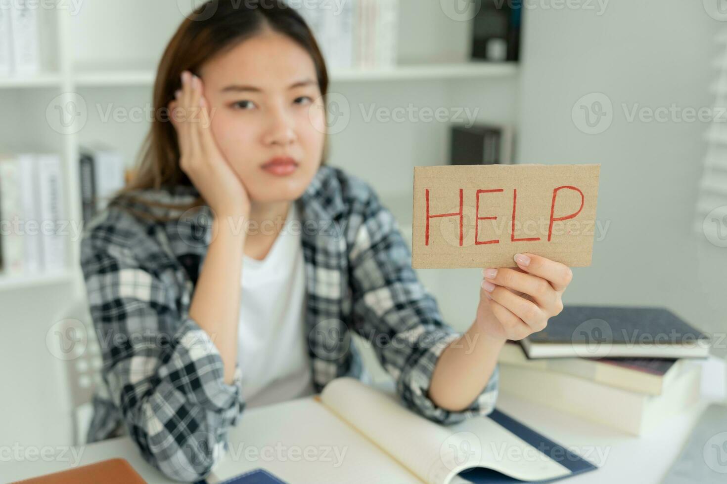 Asian student woman have anxiety because of exams, female prepare for test and learning lessons in the library. stress, despair, haste, misunderstanding reading, discouraged, expectation, knowledge photo