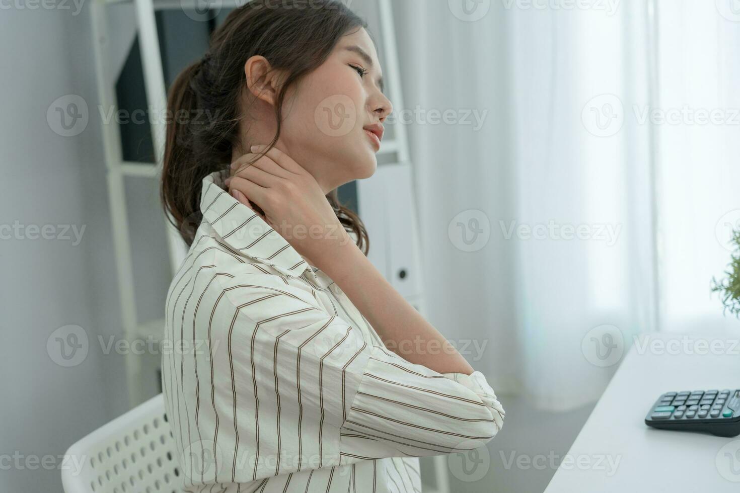 office syndromes, woman massaging neck pain due to work and using a computer, digital composite of a focused spine of neck pain and shoulder pain symptoms , injuries, health care, medical, myositis photo