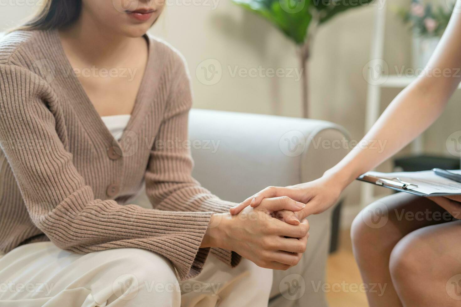 psychiatrist hold hand support each while discussing family issues. doctor encourages and empathy woman suffers depression. psychological, save divorce, Hand in hand together, trust, care photo