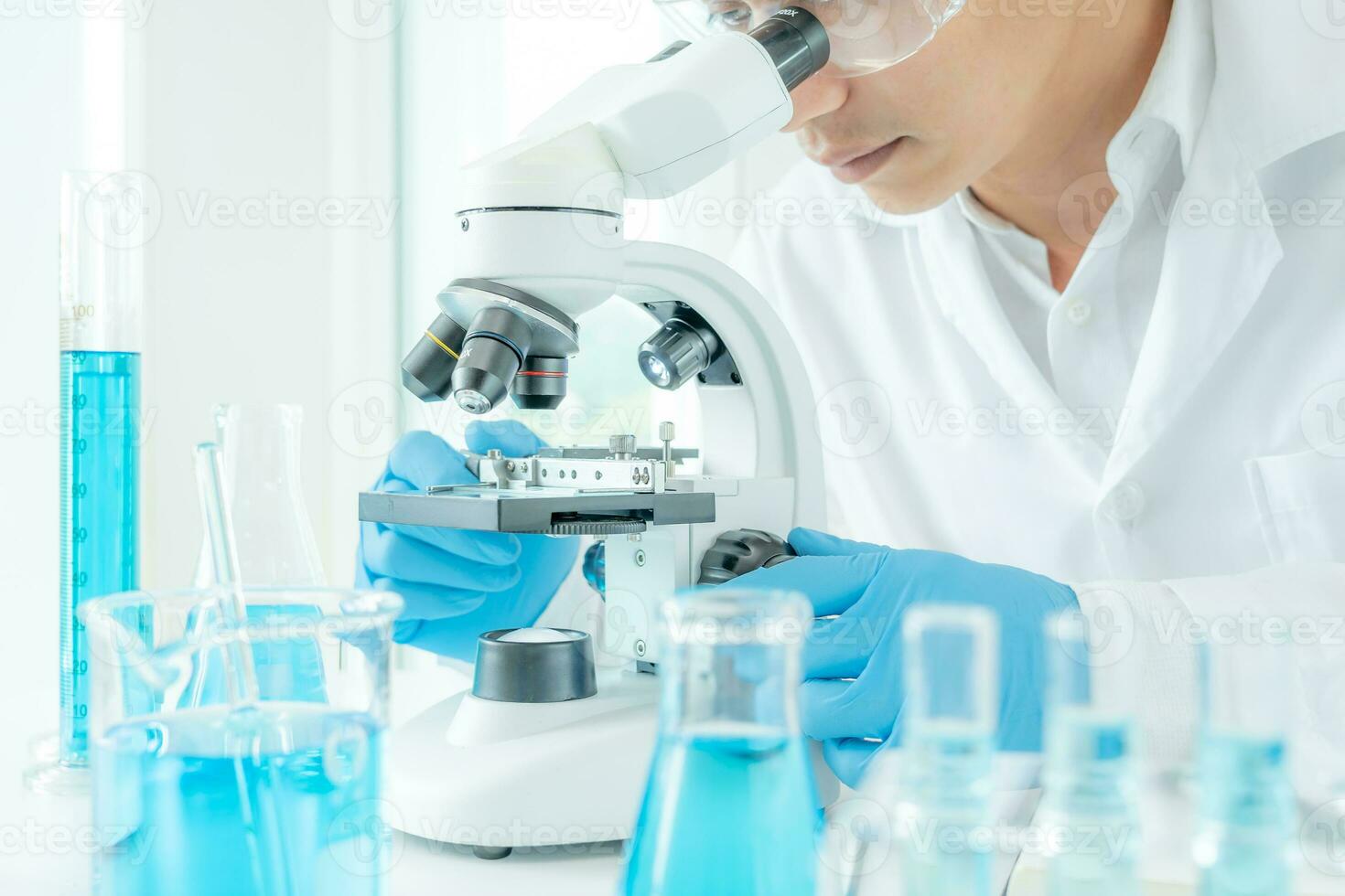 Scientist analyze biochemical samples in advanced scientific laboratory. Medical professional use microscope look microbiological developmental of viral. Biotechnology research in science lab. photo