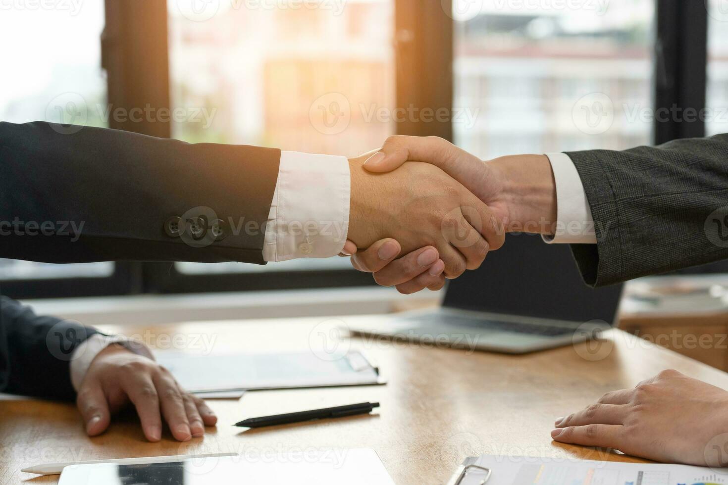 Executives are shaking hand after results success to target. financial data analysis and market growth report chart. Planning Strategies, startup project, profitable strategy, Business meeting time photo