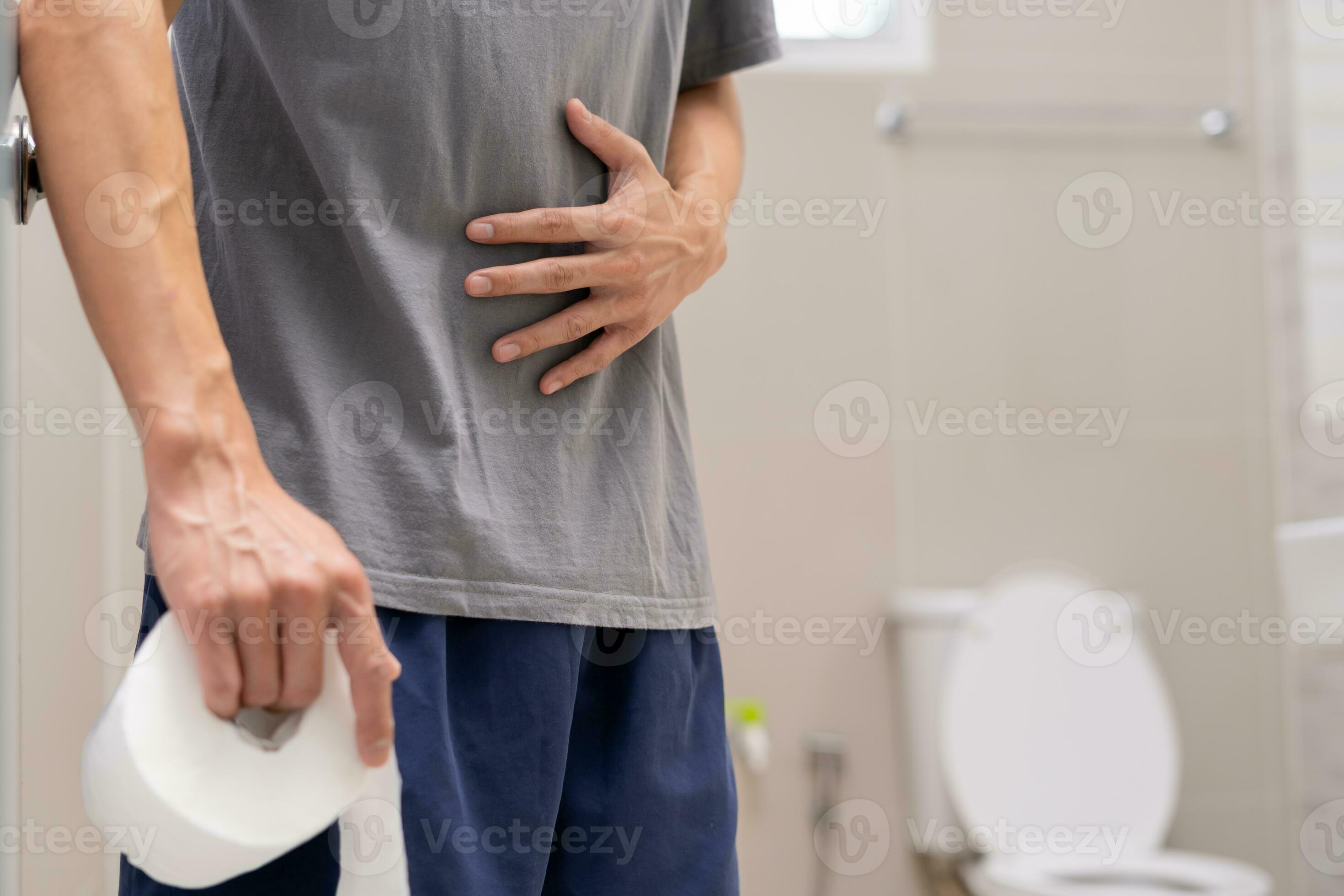 Constipation and diarrhea in bathroom. Hurt man touch belly stomach