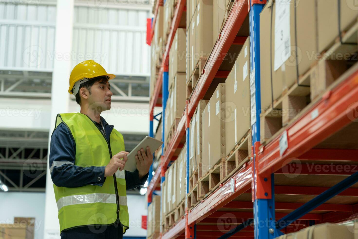 Asian male factory manager inspect goods in warehouse or inventory and check stock product. Transport logistic business shipping, delivery to customers. inspection, storehouse, storage, factory photo