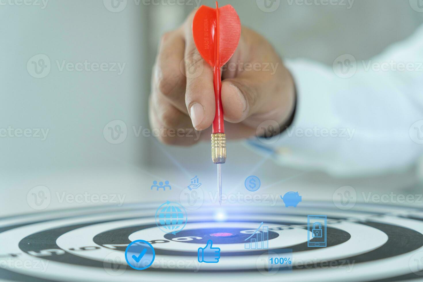 Businessman set goals for work. Hand holding a dart aiming at the target center business. goal, aiming marketing target metaphor, Succeed dart board, defines objectives, success investment ideas. photo
