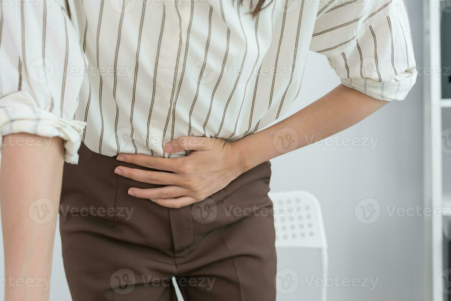 stomach ache. Asian women have abdominal pain, indigestion, gastritis, menstrual cramps, flatulence, diarrhea, distention, colon cancer, belly inflammation problem, suffer food poisoning, abdomen photo