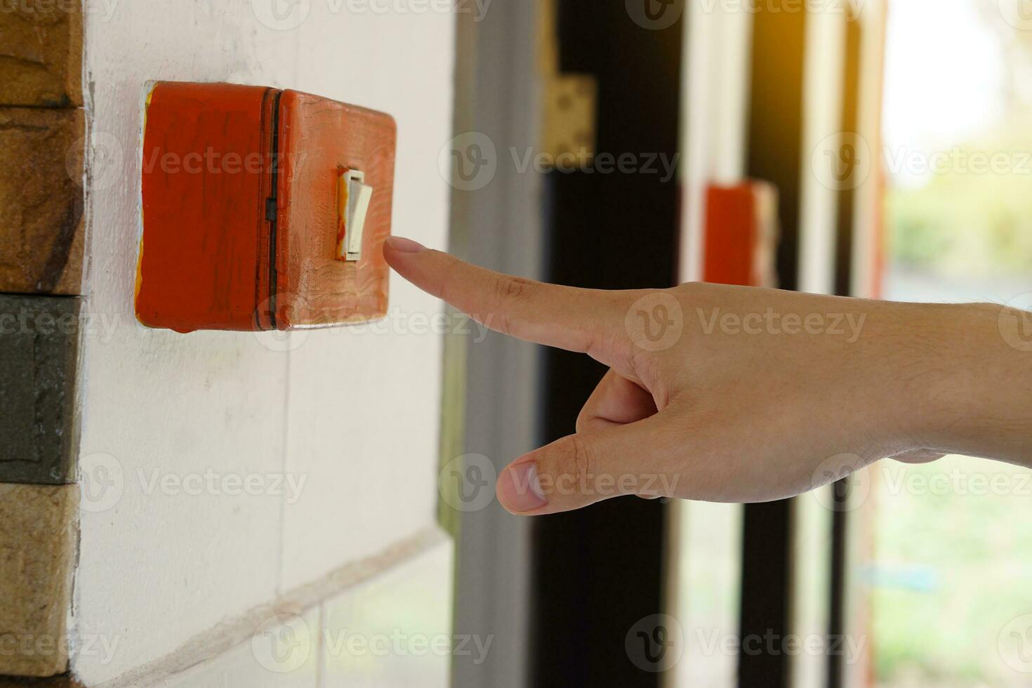 Closeup hand is press electric switch to switch off the light after using. Concept, campaign to save electricity energy. Stop global warming. Eco lifestyle. photo