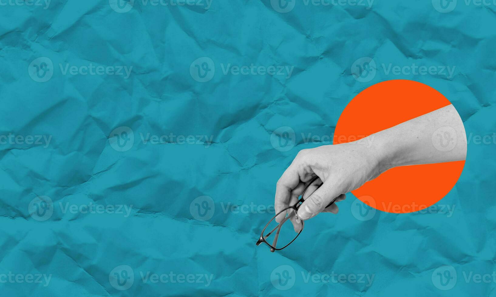 Composite collage, art collage image of a hand with glasses on a paper background of blue and orange circles. photo