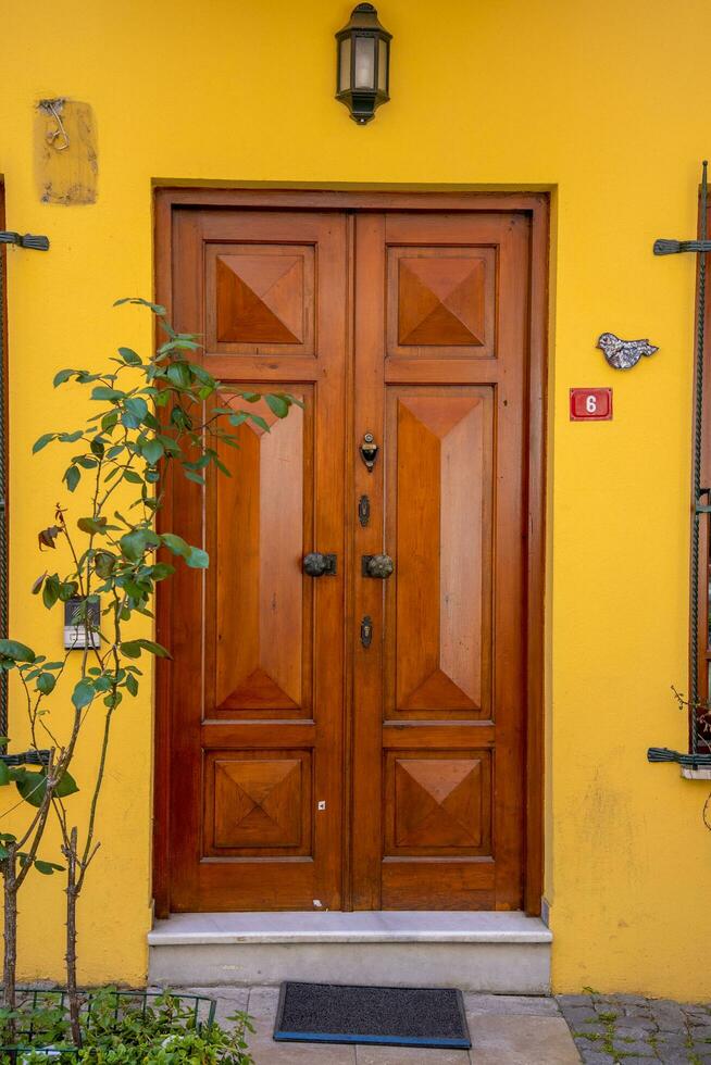 The front door is brown wood, in the old style. photo