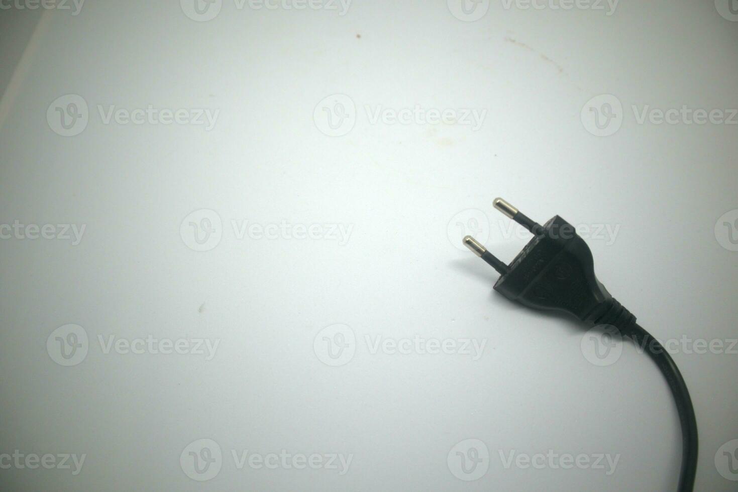 plug with black wire isolated on white background photo