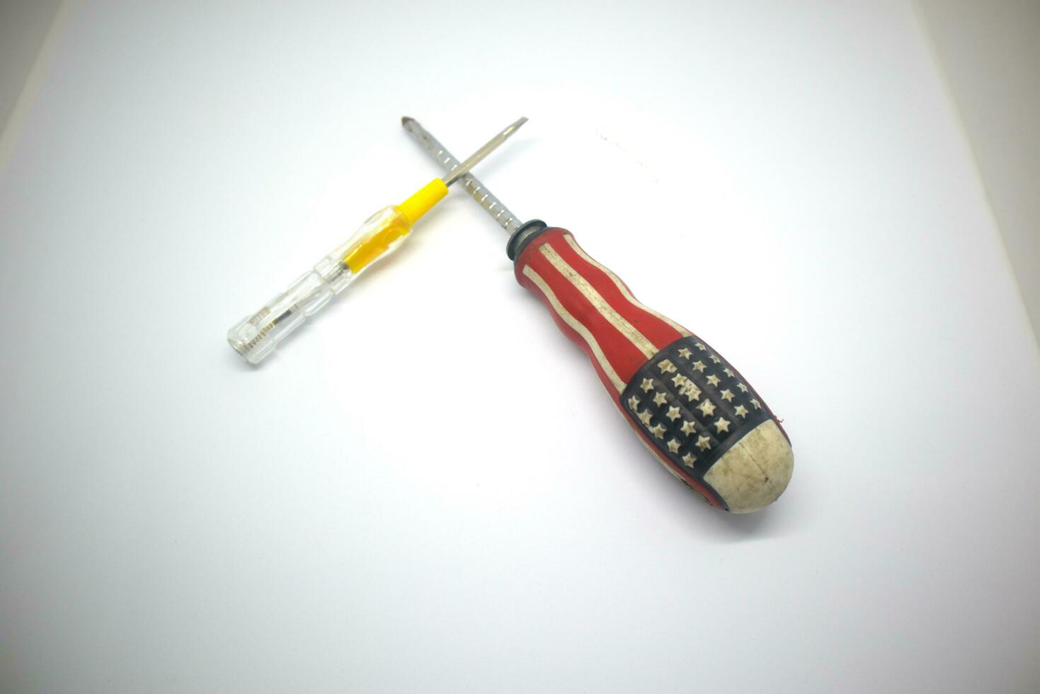 small screwdriver and large screwdriver isolate white background photo