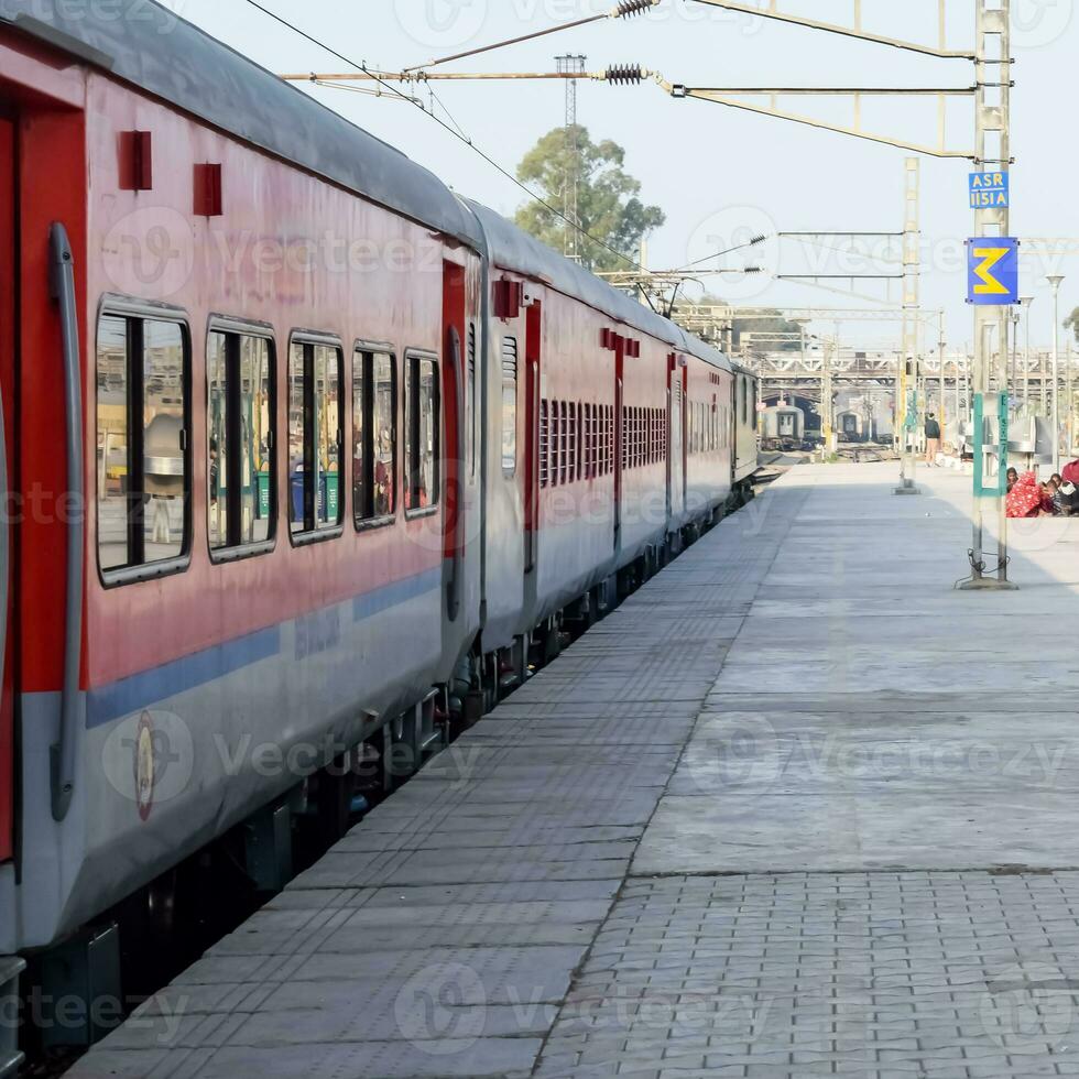 Indian railway train at Amritsar railway station platform during morning time, Colourful train at Amritsar, Punjab railway station photo