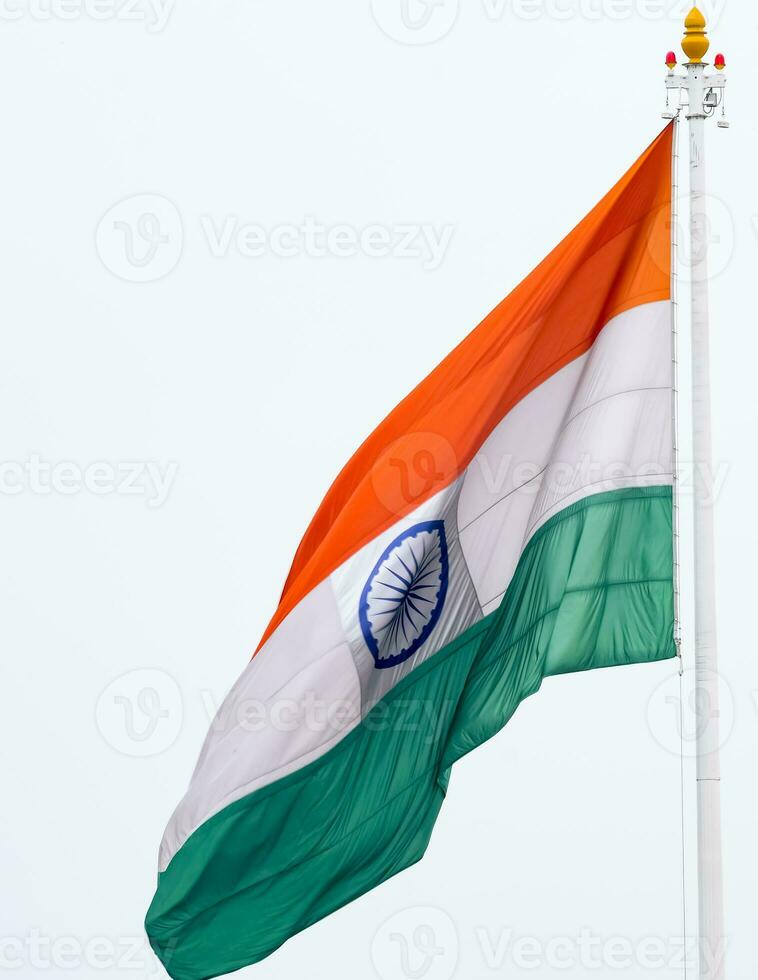 India flag flying high at Connaught Place with pride in blue sky, India flag fluttering, Indian Flag on Independence Day and Republic Day of India, tilt up shot, Waving Indian flag, Har Ghar Tiranga photo