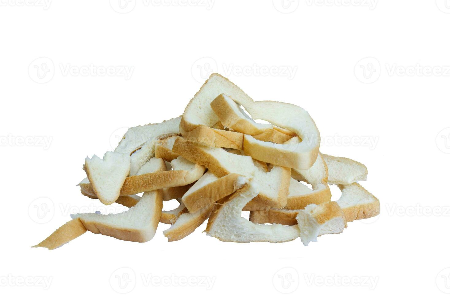 bread crubms white and brown torn to wasted food. edge of bread. photo