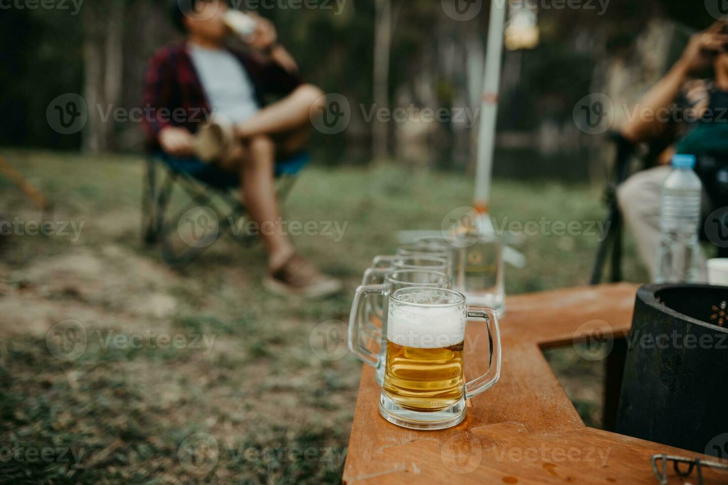 selective focus beer glass in the camping photo