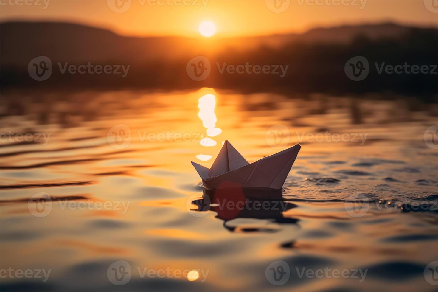 A paper boat floating in the water. photo