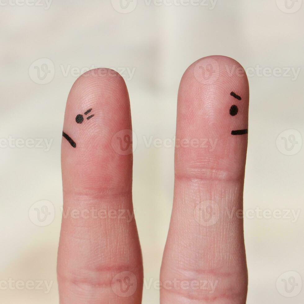 Finger art of couple. Couple after an argument looking in different directions. photo