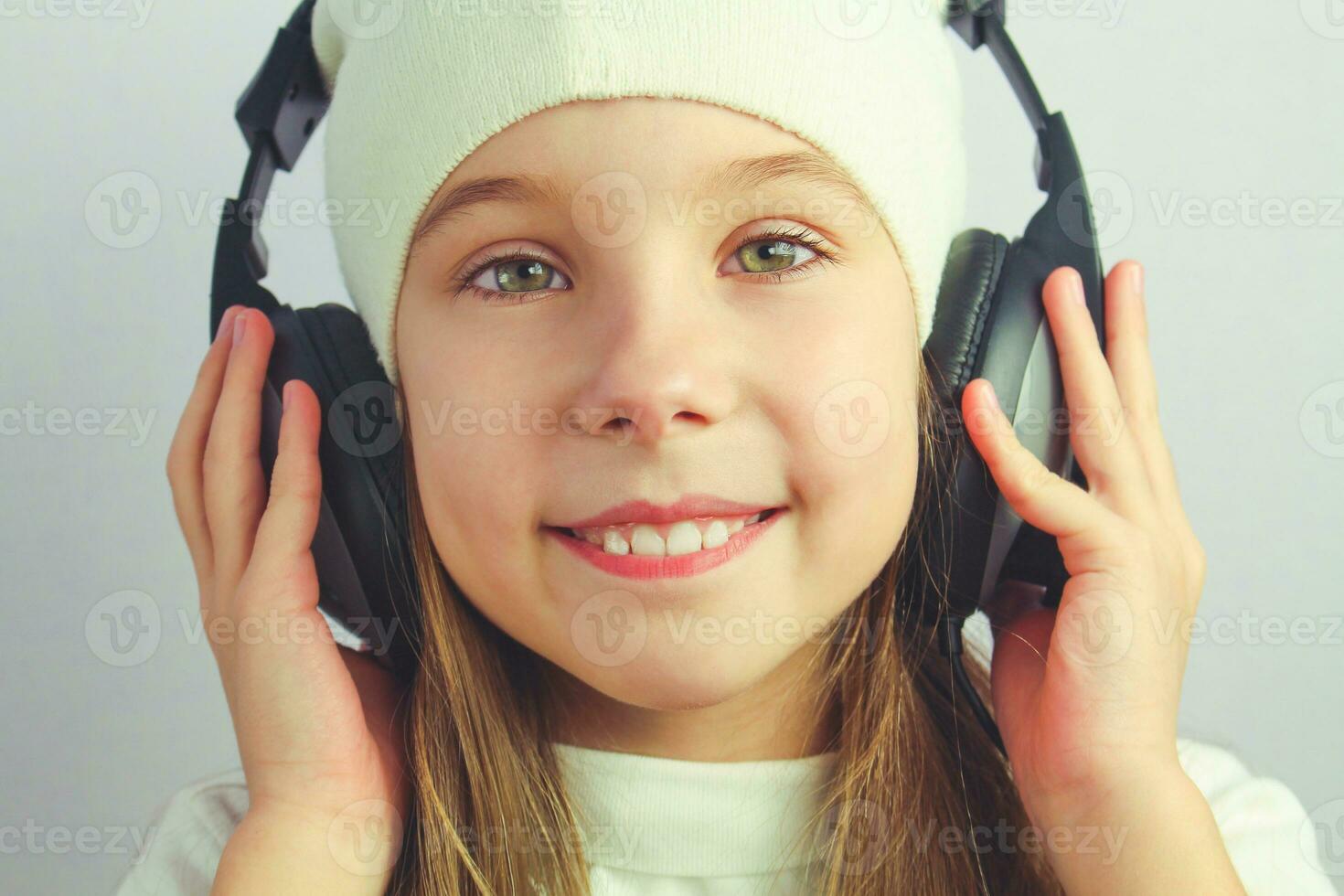 Beautiful girl with headphones. Toned image. photo