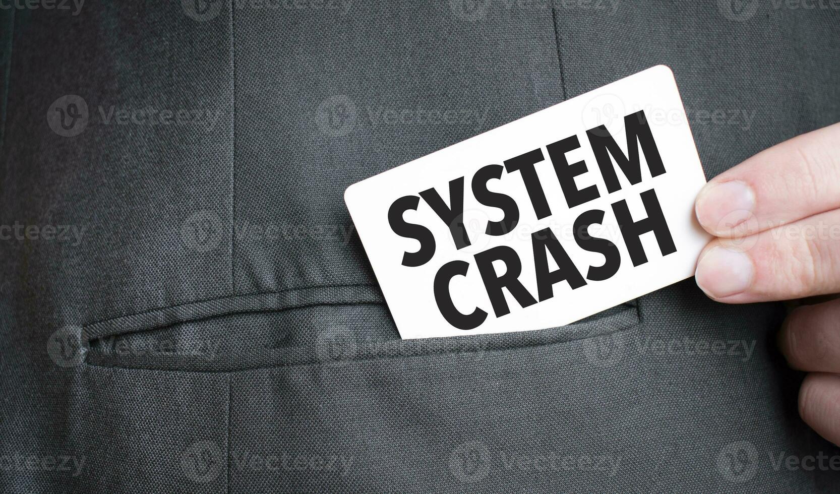 Card with SYSTEM CRASH text in pocket of businessman suit. Investment and decisions business concept. photo