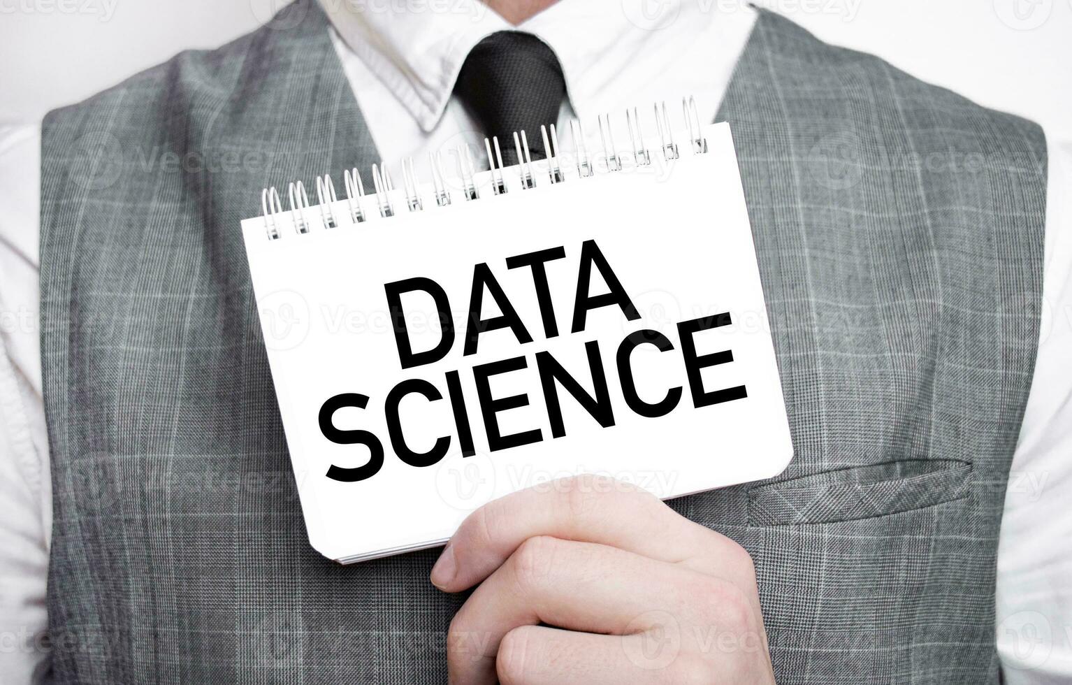 Businessman with notebook with text DATA SCIENCE photo