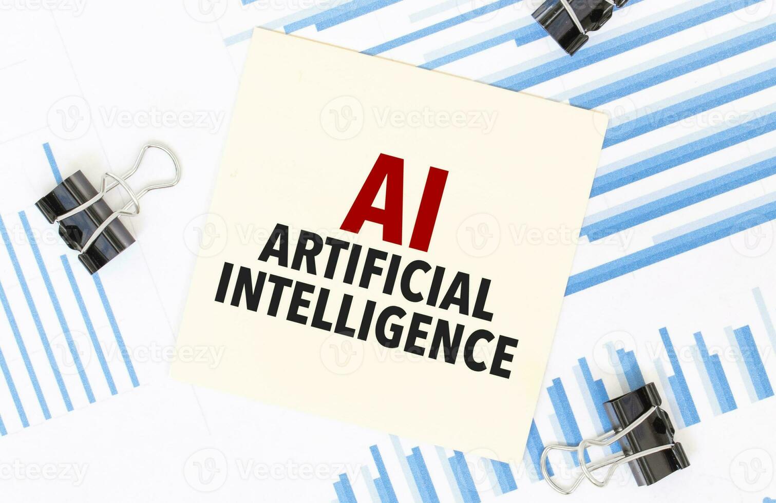 Yellow sticky notes with text AI - Artificial Intelligence on the white office desk. Business concept. photo