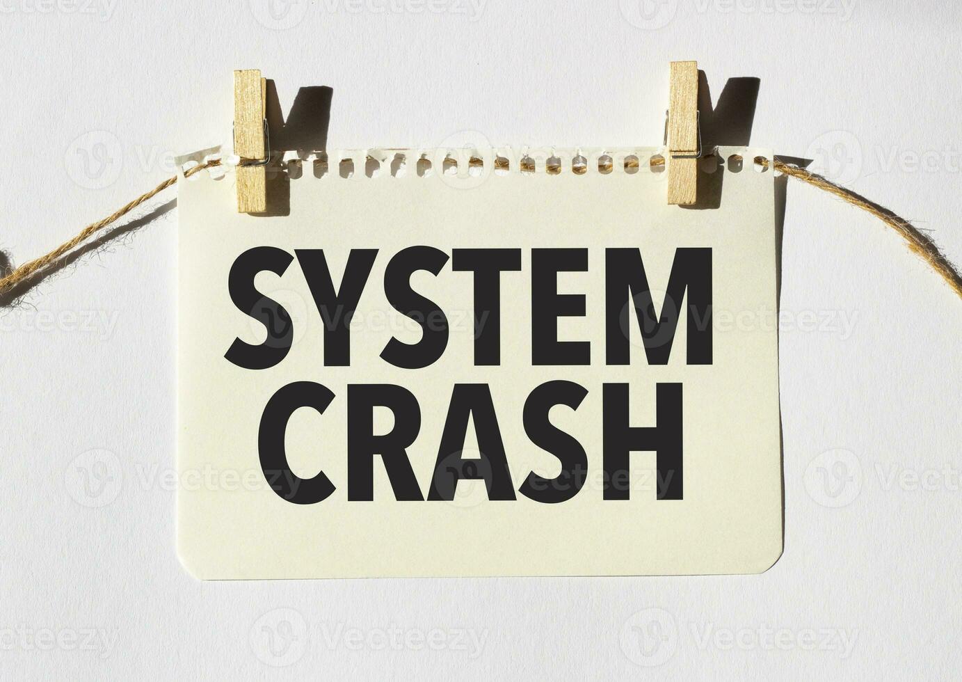 Card with text SYSTEM CRASH . Diagram and white background photo