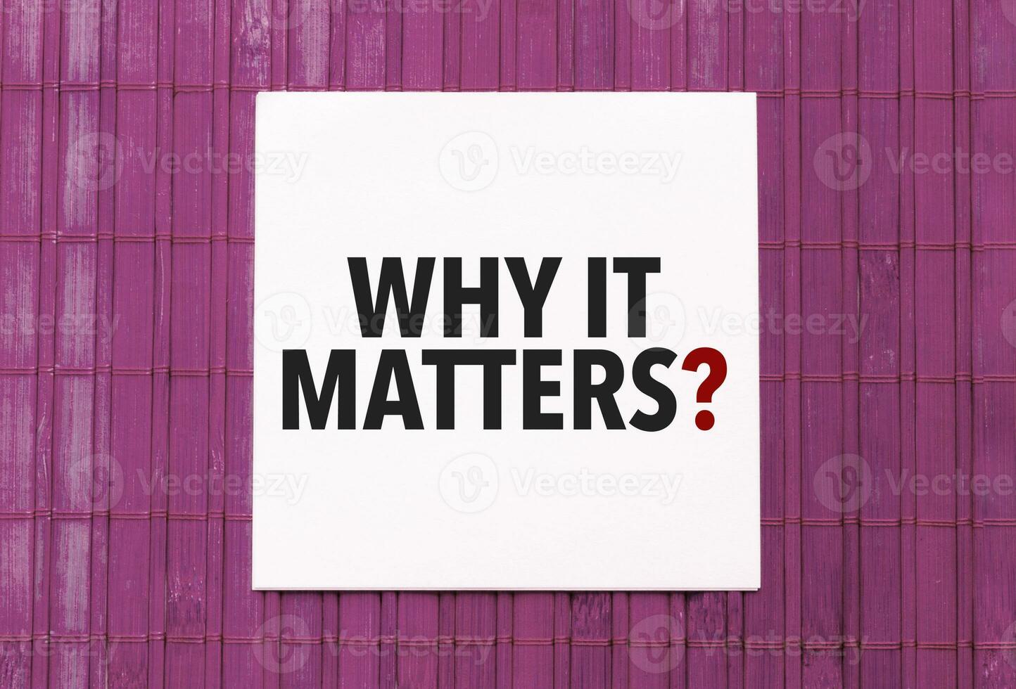 blank note pad with text why it matters on blue wooden background photo