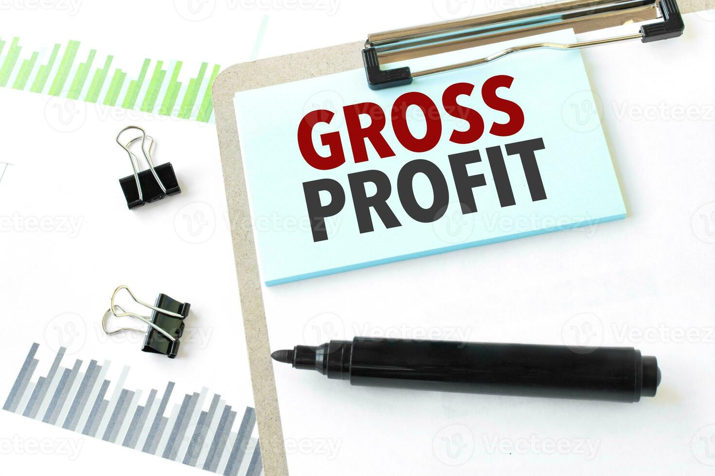 Paper plate, marker, diagram, chart and office tools. Text GROSS PROFIT photo