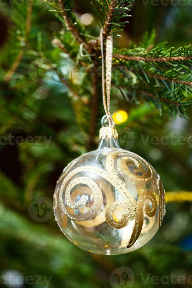 decorated glass ball on natural christmas tree photo