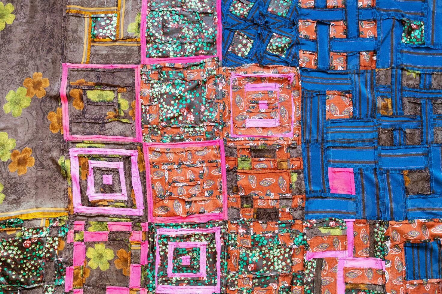 rear view of handcrafted motley patchwork cloth photo