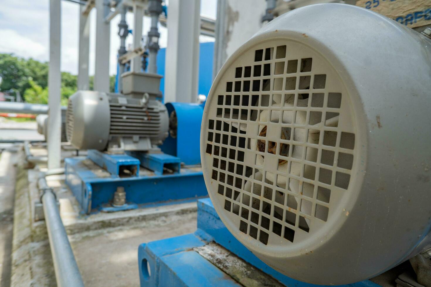 Water pump couple with motor for waster water treatment process. The photo is suitable to use for industry background photography, power plant poster and electricity content media.
