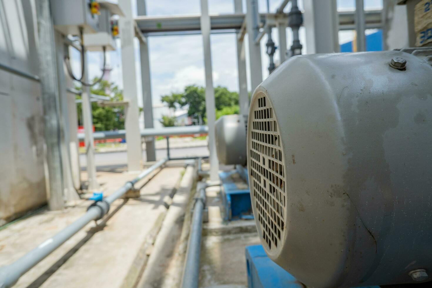 Water pump couple with motor for waster water treatment process. The photo is suitable to use for industry background photography, power plant poster and electricity content media.