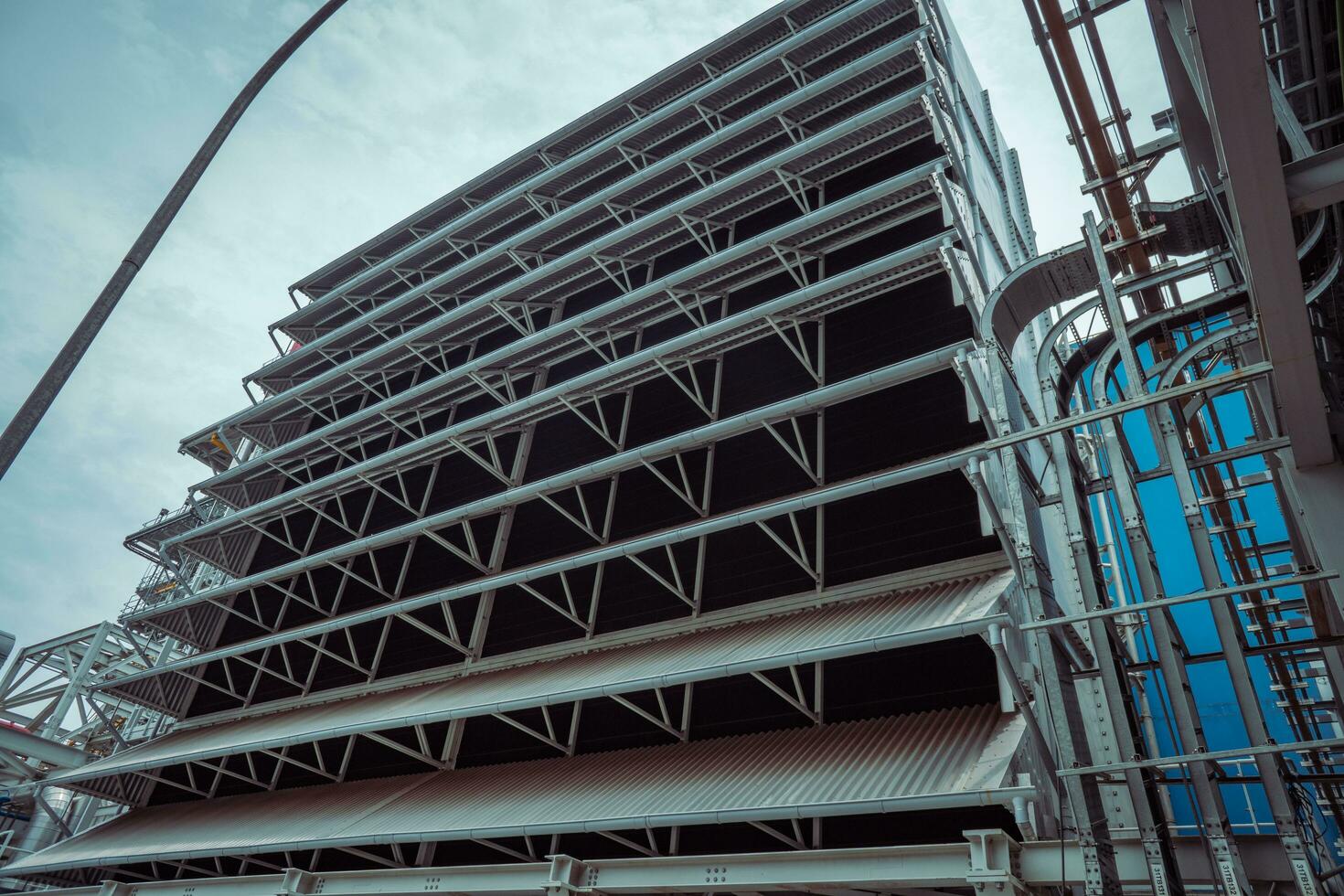 Heat recovery Steam Generator with pipe line, air intake and Up stair. The photo is suitable to use for industry background photography, power plant poster and electricity content media.