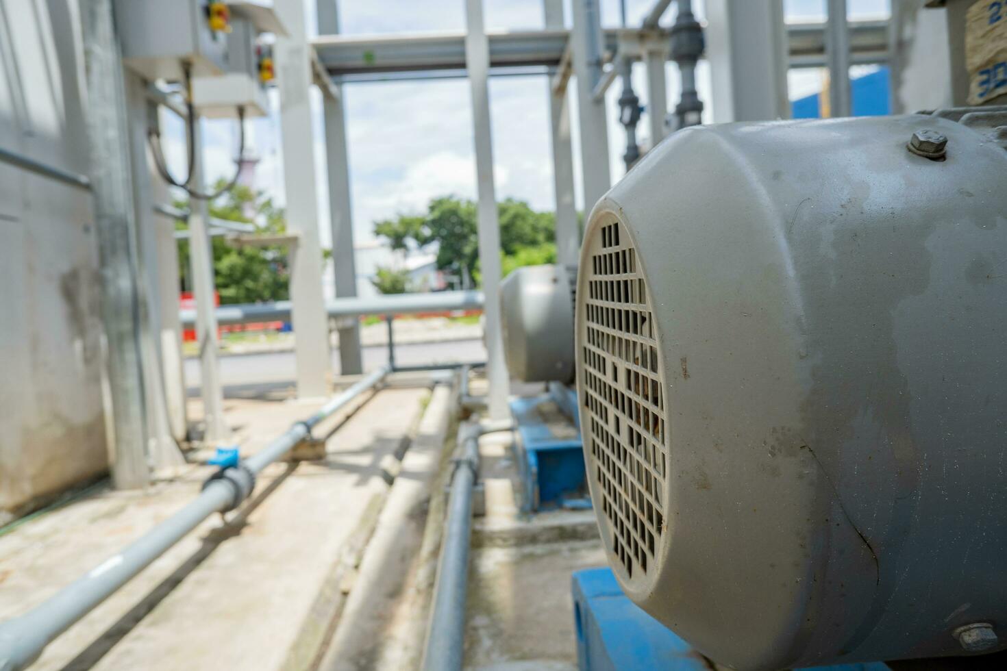 Water pump couple with motor for waster water treatment process. The photo is suitable to use for industry background photography, power plant poster and electricity content media.
