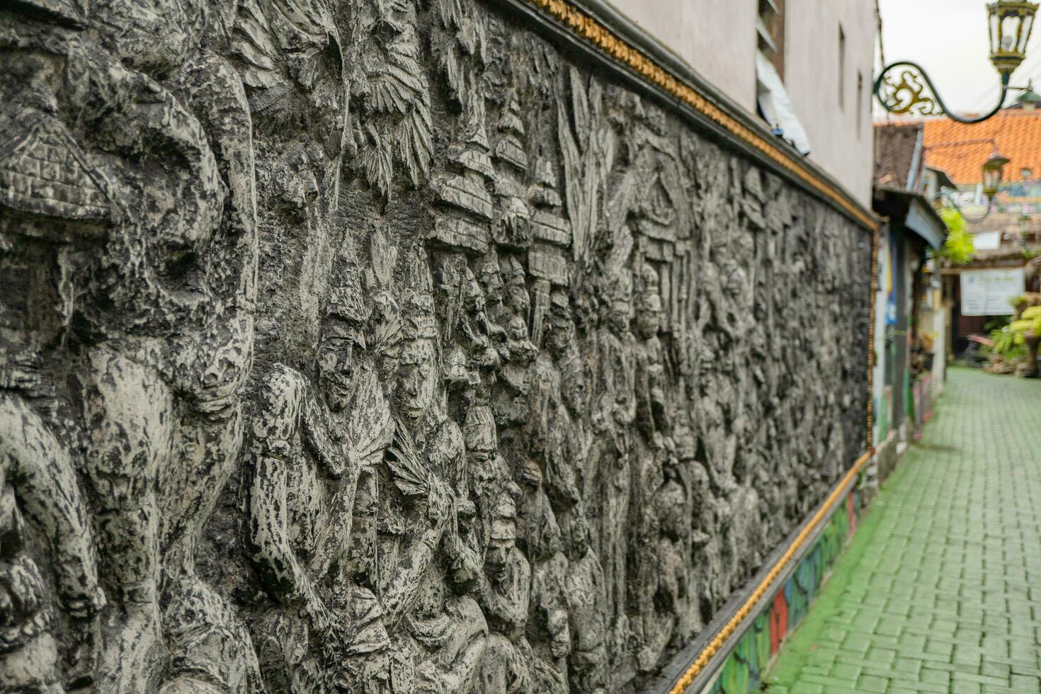 Texture and surface of batik carving on wall at Semarang. The photo is suitable to use for culture background, travel destination poster and travel content media.
