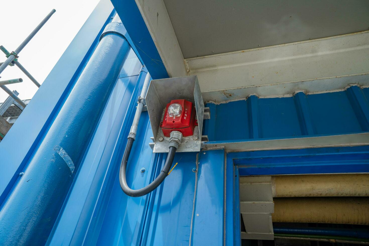 Fire alarm horn on the near door of pump house. The photo is suitable to use for industry background photography, power plant poster and electricity content media.