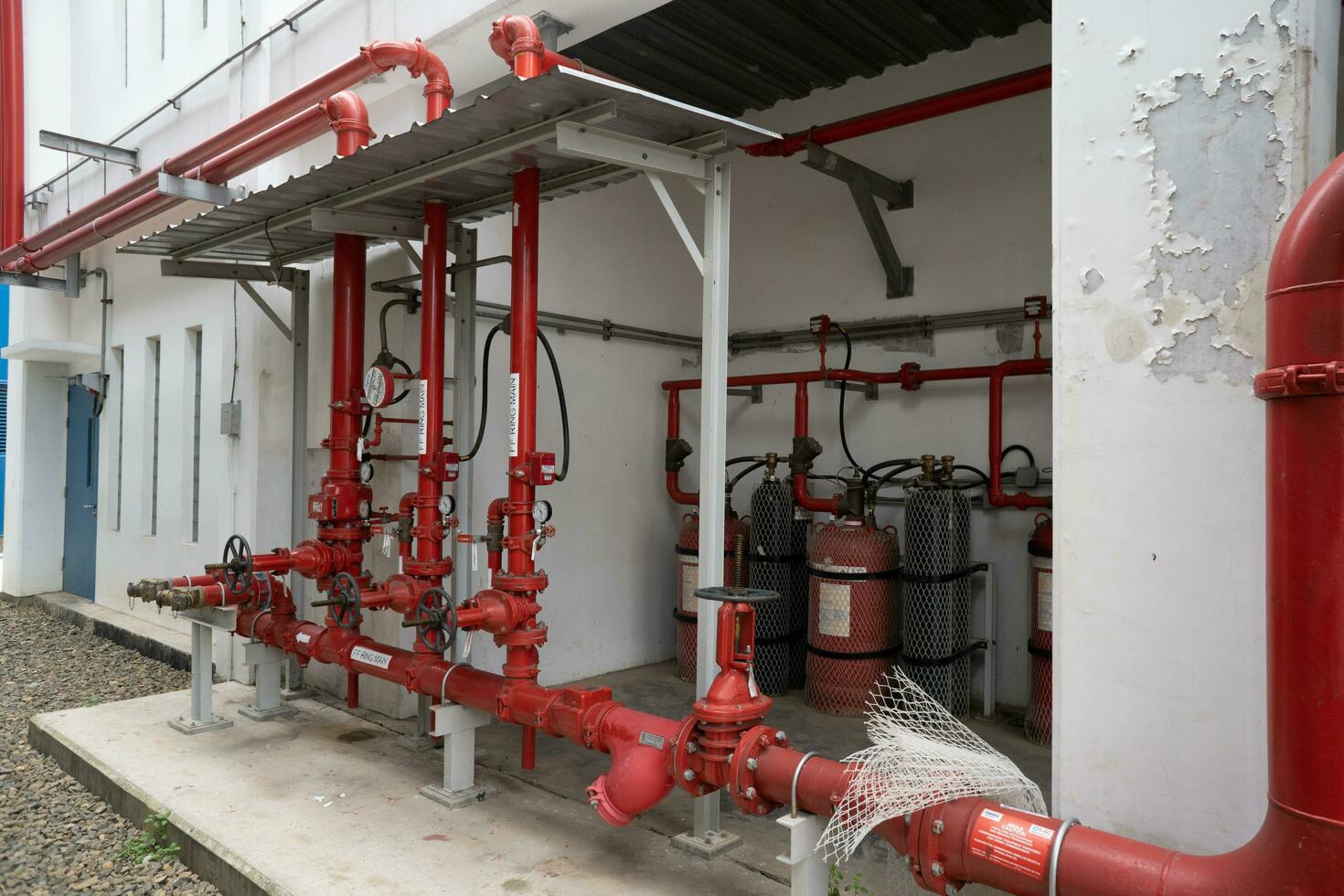 Photo of hydrant tower fire fighting system protection of the power plant. The photo is suitable to use for industry background photography, power plant poster and safety content media.