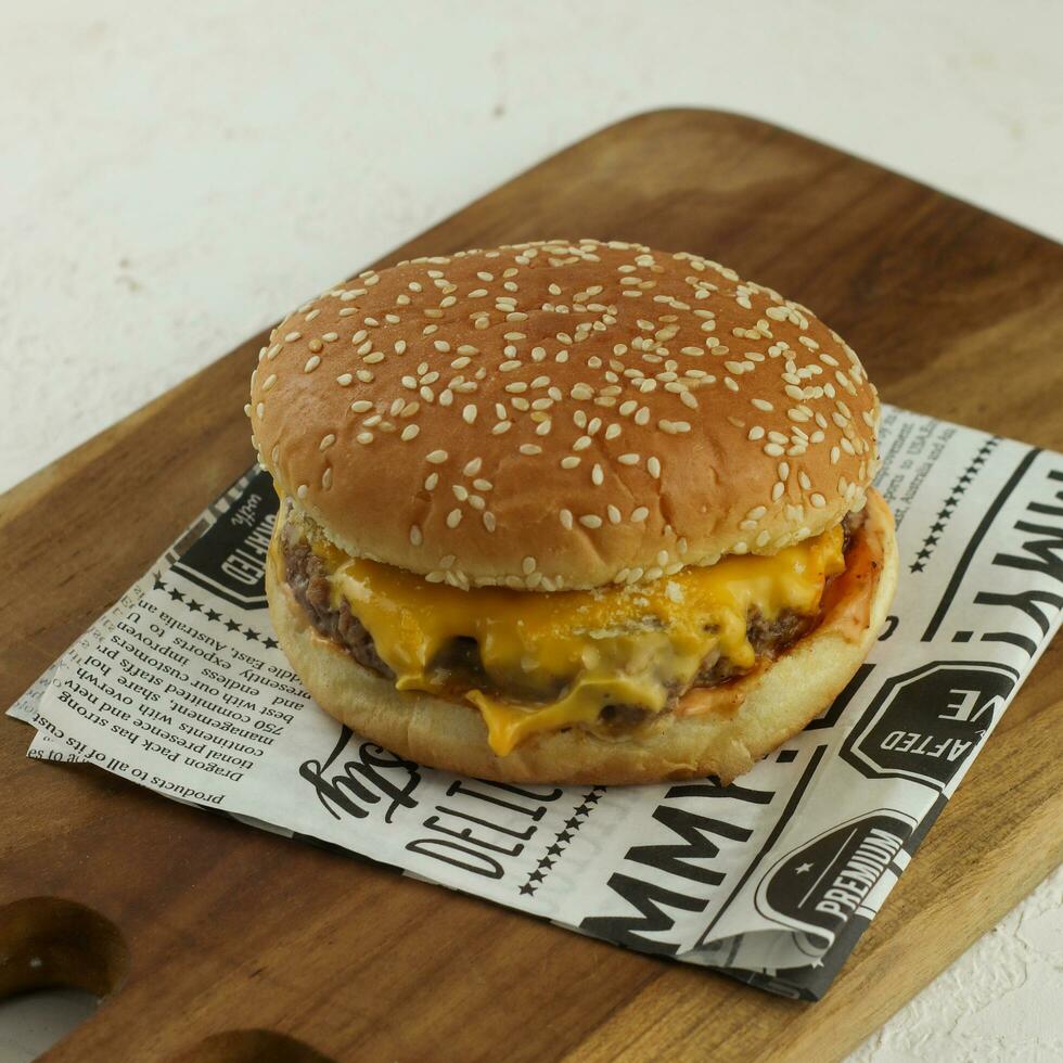 Studio shot of ready-to-eat, homemade hamburger with fresh vegetables photo