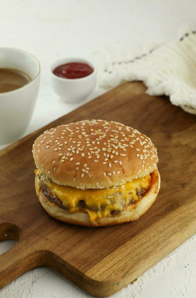 Studio shot of ready-to-eat, homemade hamburger with fresh vegetables photo