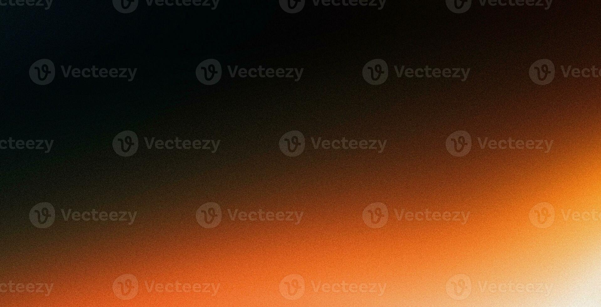 Orange glowing color gradient on black grainy background, noise texture effect, large banner copy space photo
