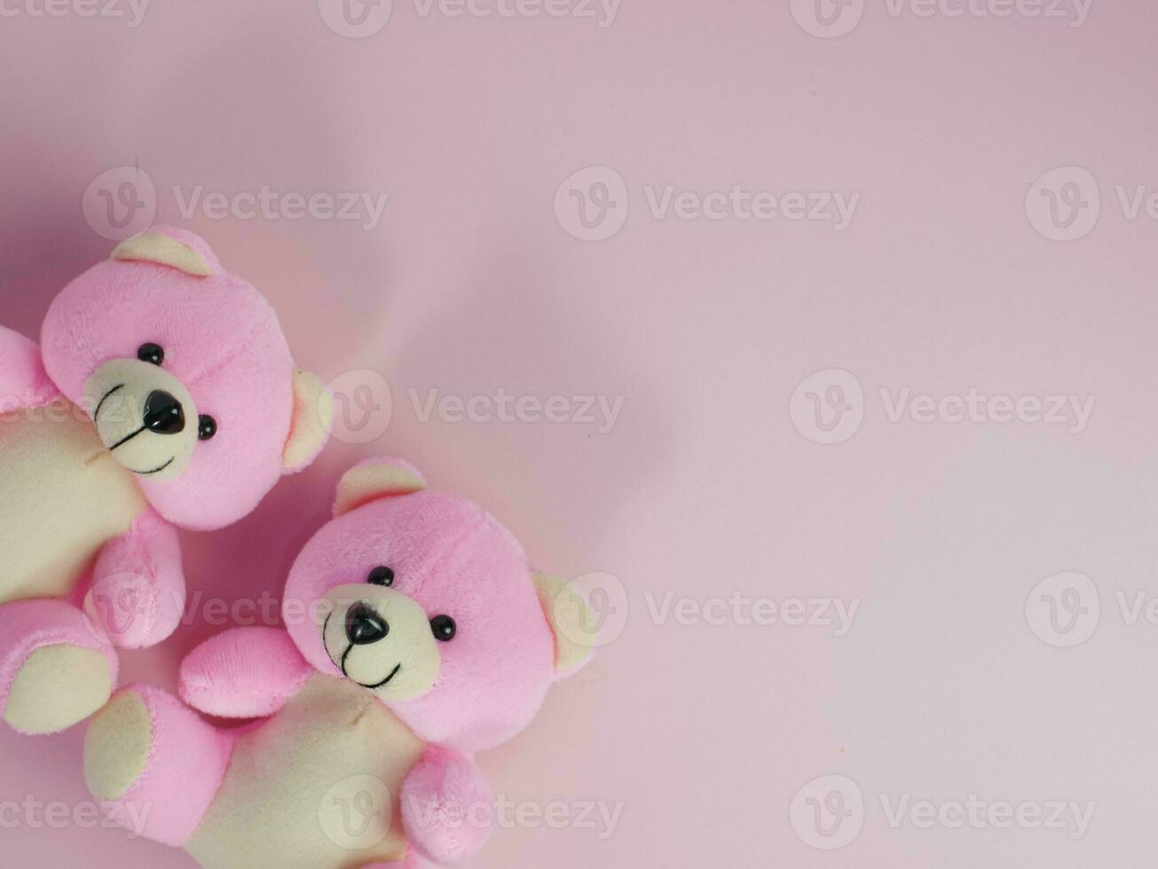 Lovely pink bear doll on pink background. adorable pink bear for decorative. with copy space for text photo