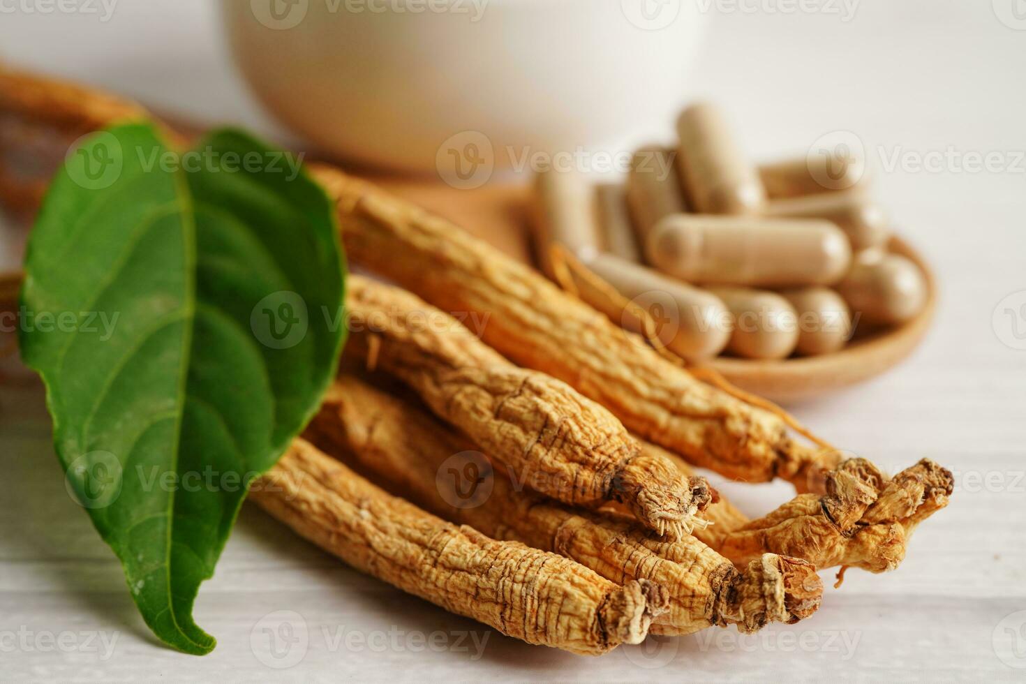 Ginseng roots and green leaf, healthy food. photo