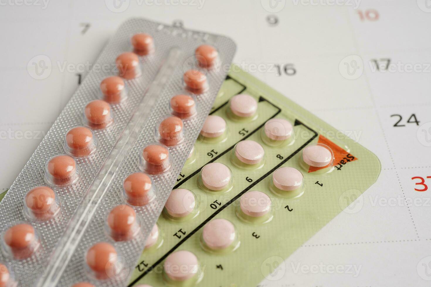 Pregnancy test for female on calendar, ovulation day. photo