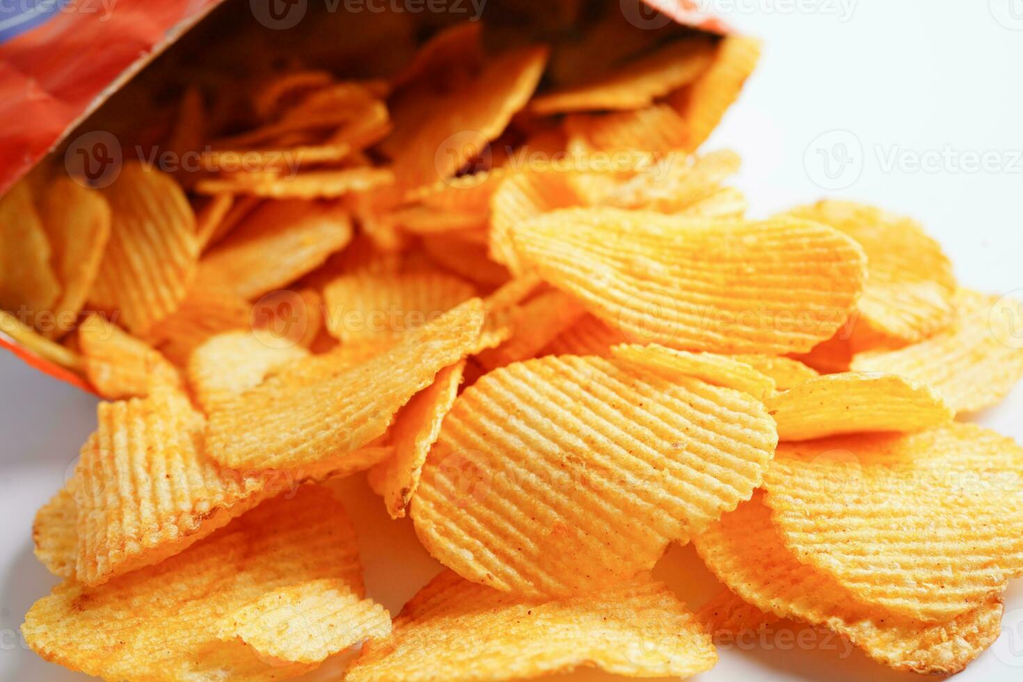 Potato chips in open bag, delicious BBQ seasoning spicy for crips, thin slice deep fried snack fast food. photo