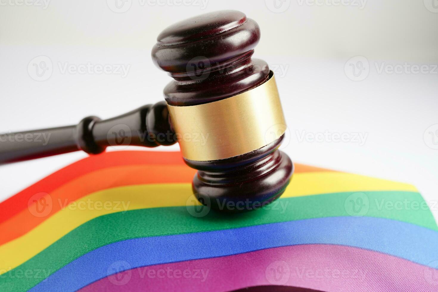 Gavel for judge lawyer with heart rainbow flag, symbol of LGBT pride month. photo