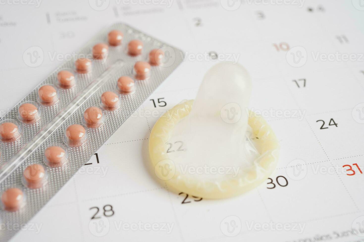 Condom and birth control pills for prevent infection, safe sex  and birth control. photo