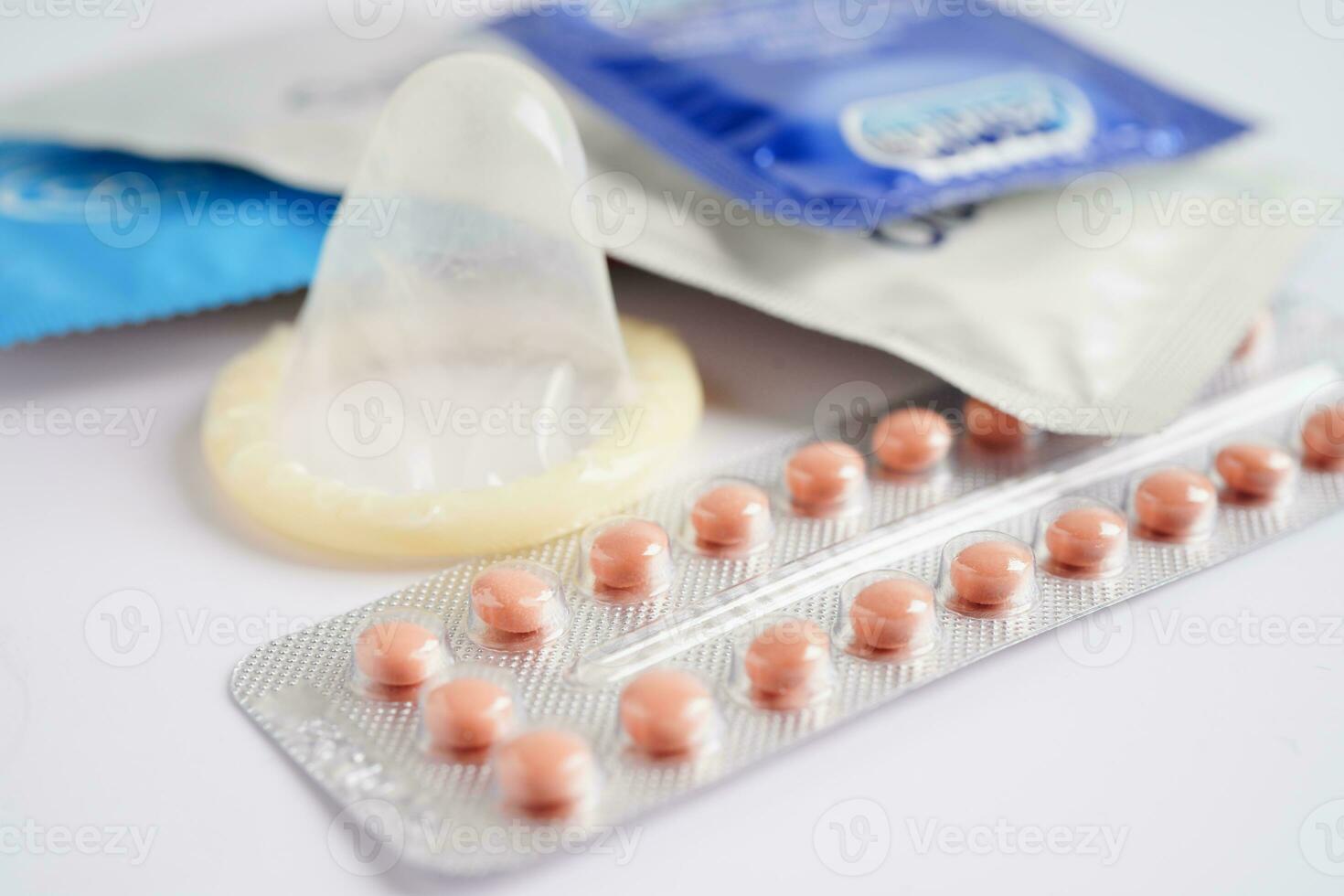 Condom and birth control pills for prevent infection, safe sex  and birth control. photo