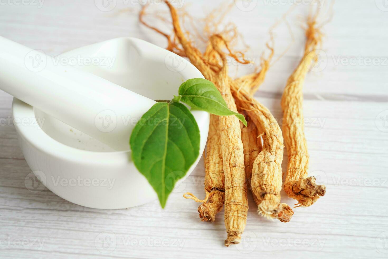 Ginseng roots and green leaf, healthy food. photo