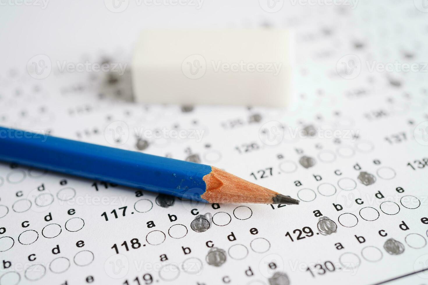 Answer sheets with pencil drawing fill to select choice, education concept. photo