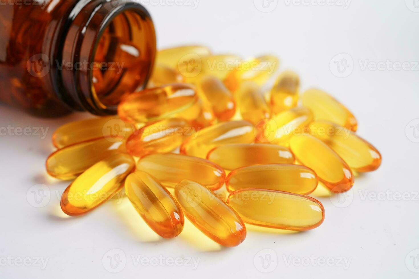 Fish oil or Cod liver oil gel in capsules with omega 3 vitamins, supplementary healthy food photo